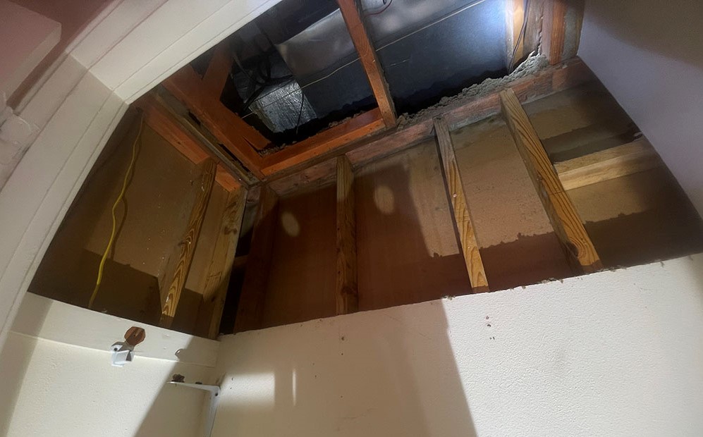 Drywall closet ceiling cut back cleanly to solid joists and studs